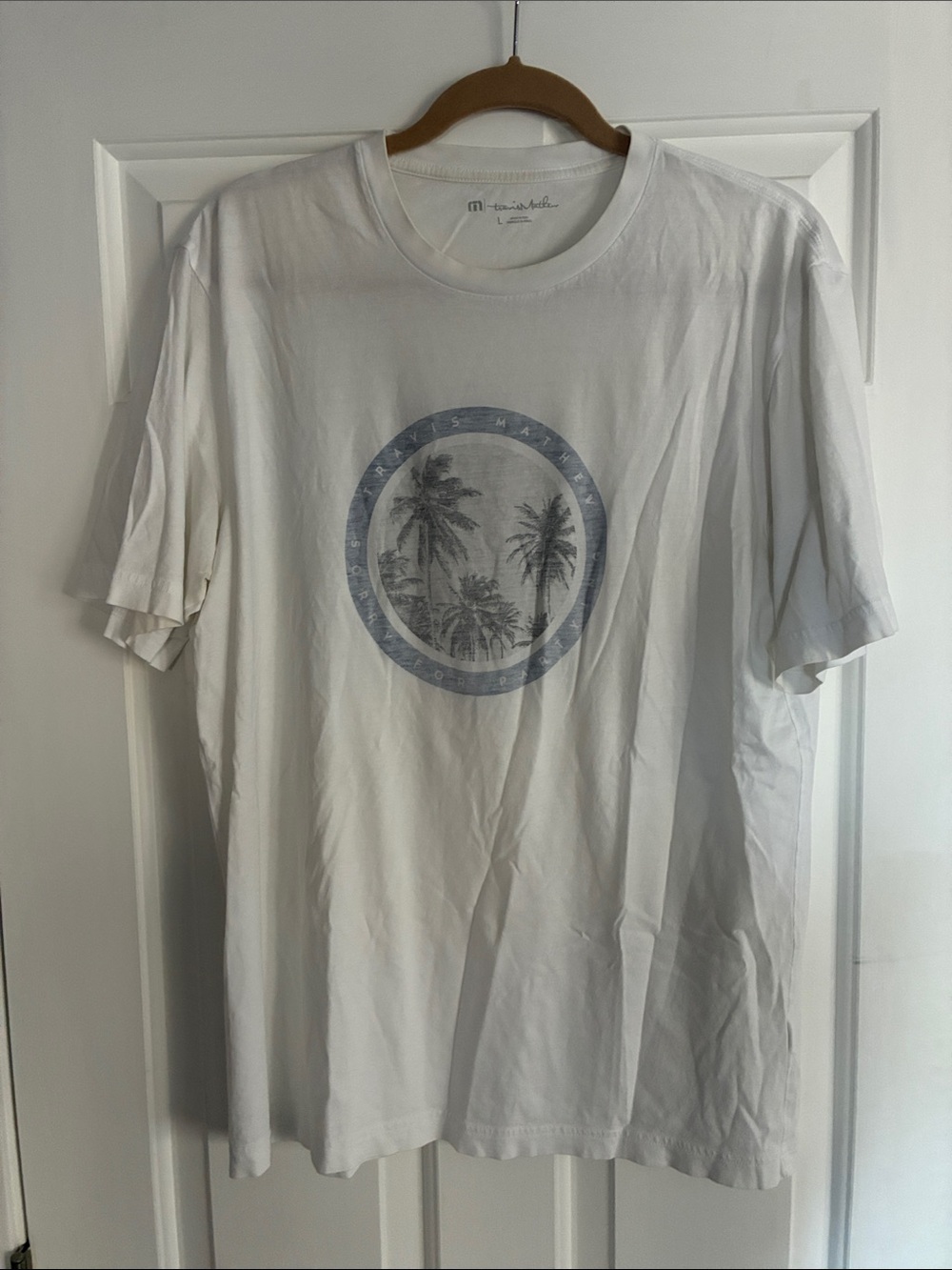 Travis Mathew White T-Shirt with Faded Blue Palm Circle Graphic